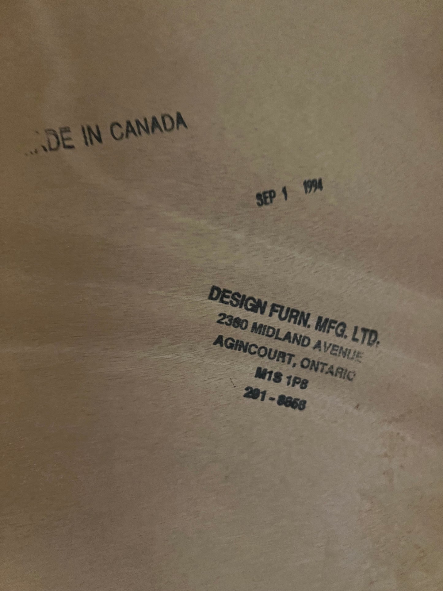 Image showing stamps on Vintage Teak Bed that say "Made in Canada, Sep 1 1994, Design Furn. MFG. LTD. Midland Ave. Ontario"